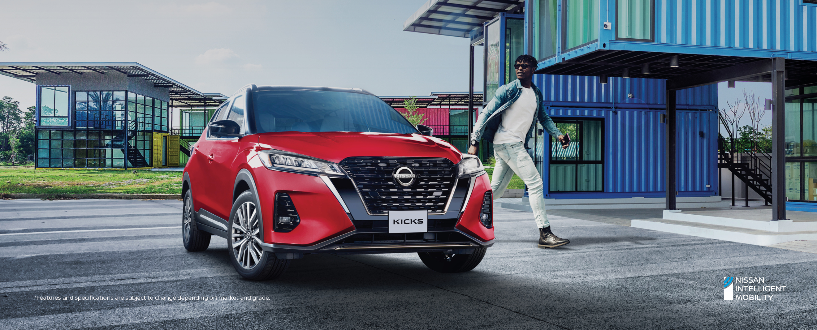 Red Nissan Kicks parked in front of a building